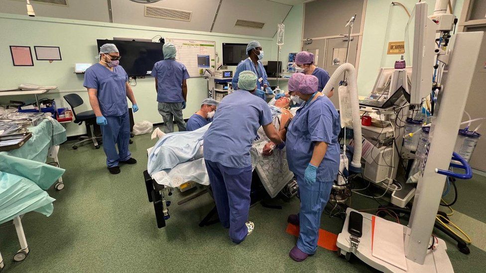 Penny Browne on the operating table at Luton and Dunstable University Hospital as surgeons perform a gastric band operation