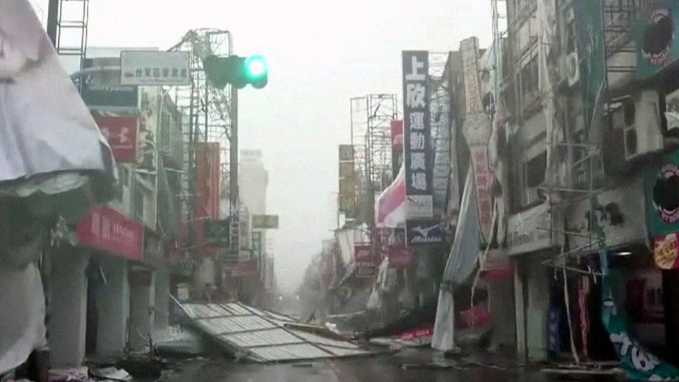 In this image made from video, wind-blown debris litters the street from Typhoon Nepartak in Taitung, south eastern Taiwan, Friday, July 8, 2016