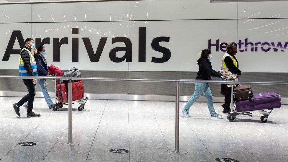 Travellers arrive at Heathrow Terminal 5