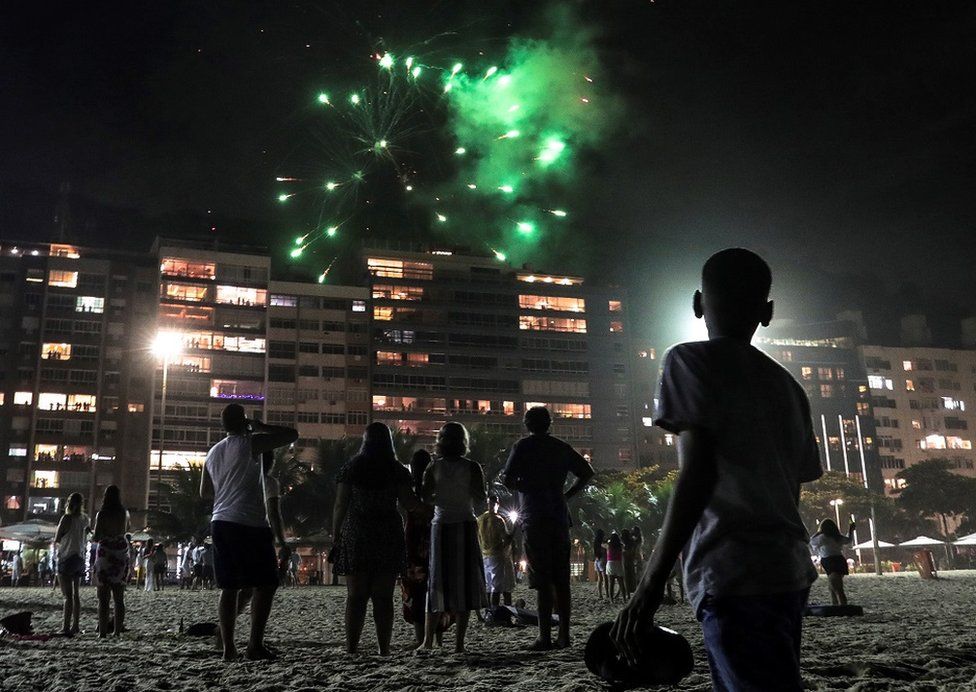 People enjoy of the end of the year celebrations at Copacabana beach in Rio de Janeiro, Brazil, 31 December 2020.
