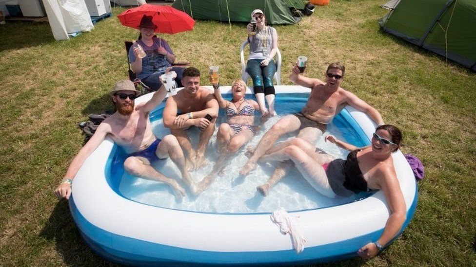 People in paddling pool at Glastonbury