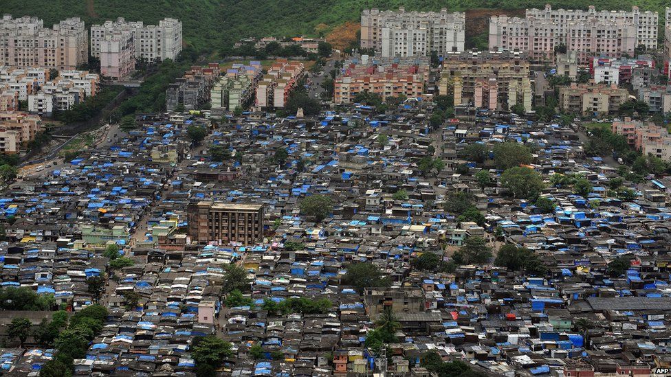 Aerial view of Mumbai skscrapers next to the city's slums