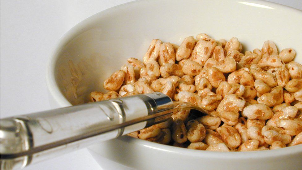 Bowl of cereal (sugar puffs) with spoon