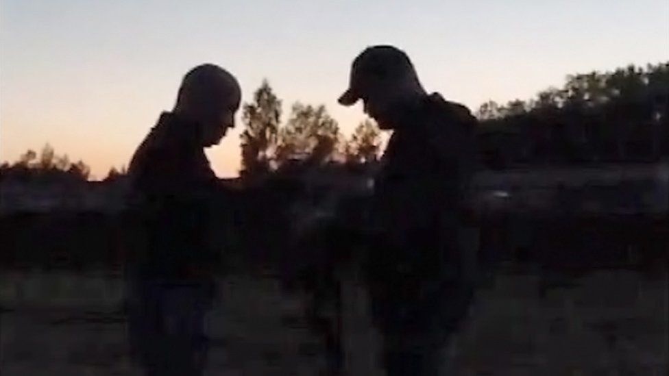 An enhanced grab from the video purporting to show Wagner leader Yevgeny Prigozhin (left) in Belarus