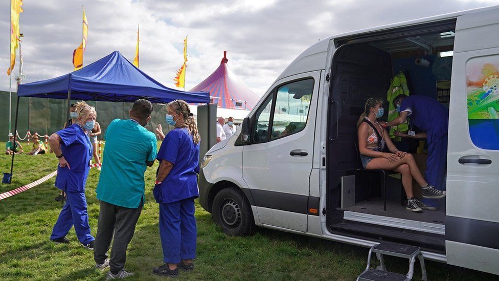 17-year-old Tamsin Bunce getting a vaccine jab at a walk-in Covid-19 vaccination clinic at the Reading Festival