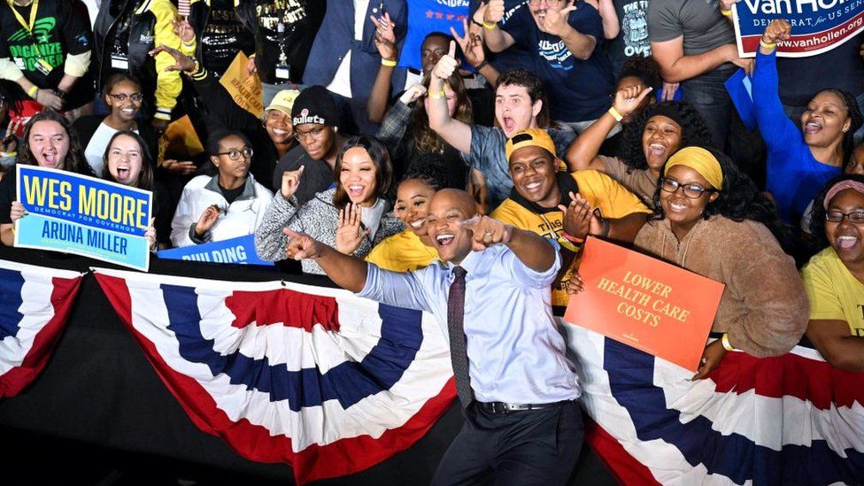 Wes Moore (centre) would become only the third black governor in the US if elected