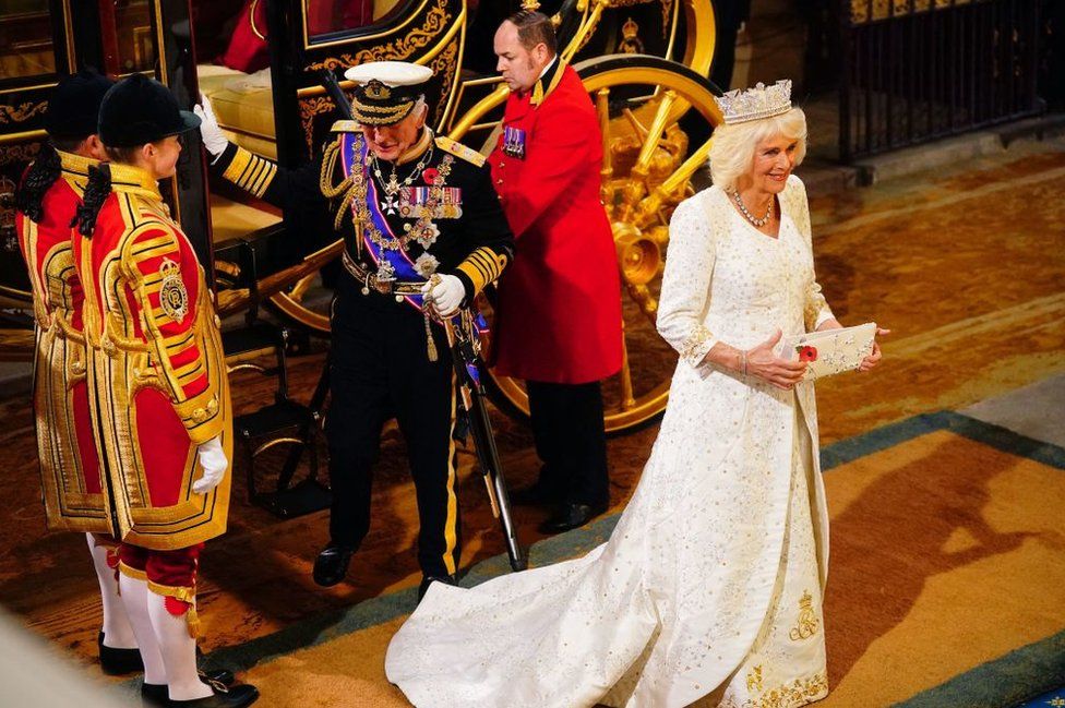Britain's King Charles III and Britain's Queen Camilla arrive at the Sovereign's Entrance of the House of Lords for the State Opening of Parliament at the Houses of Parliament, in London, on November 7, 2023.