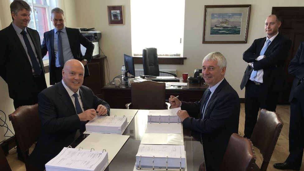 Jim McColl and Tom Docherty of CMAL signing the ferry building contract