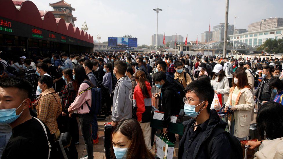 Crowds of people outside Beijing Railway station