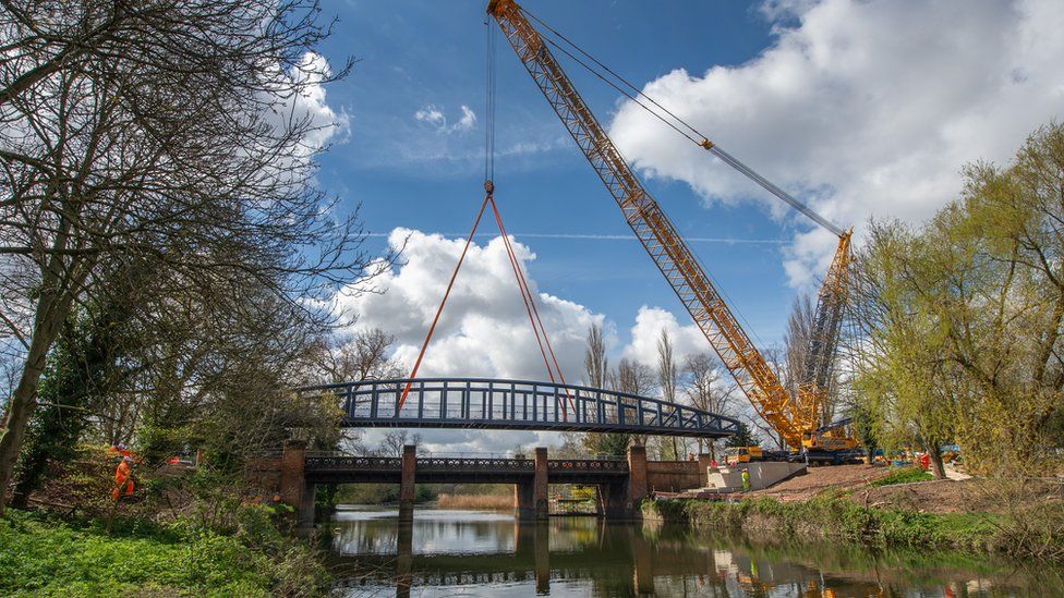 New 11ft wide (3.5m) bridge was hoisted into place by a huge crane on Saturday