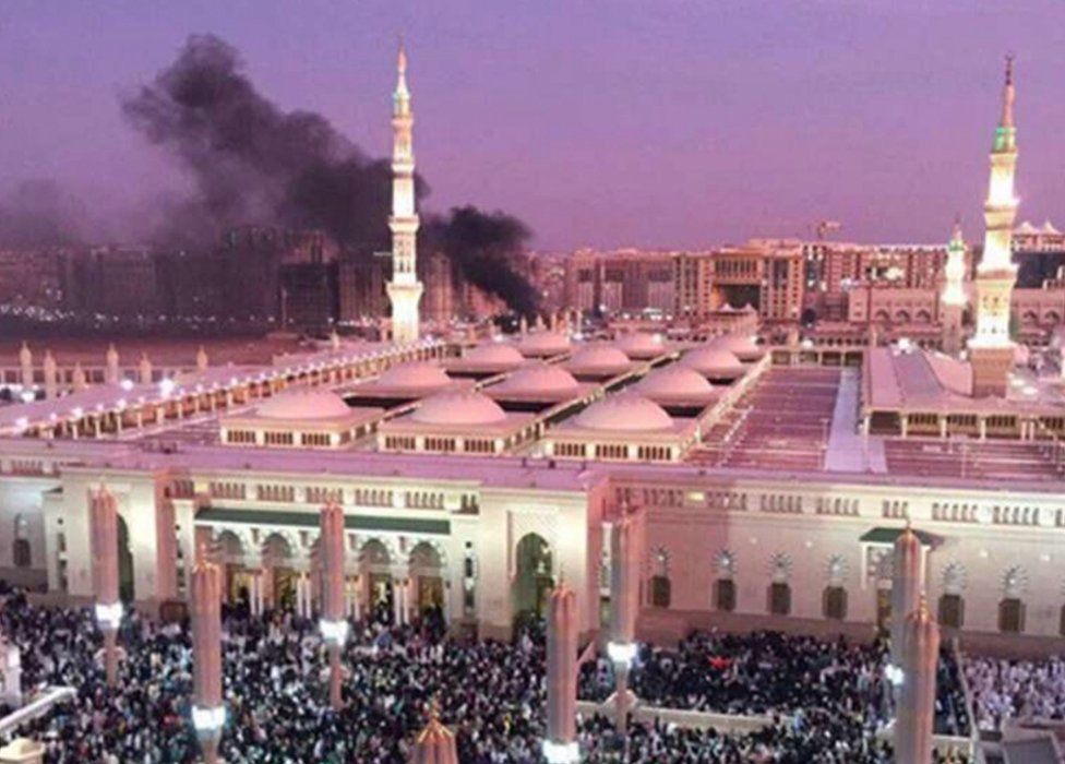 Smoke rises behind the Prophet's Mosque in Medina