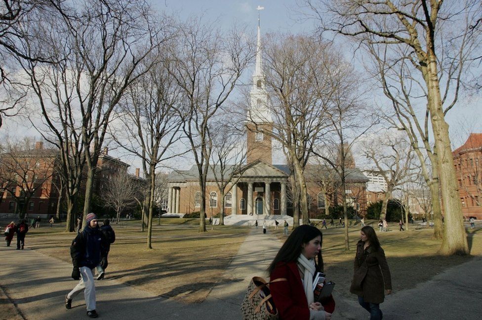 Harvard University students walk through the campus