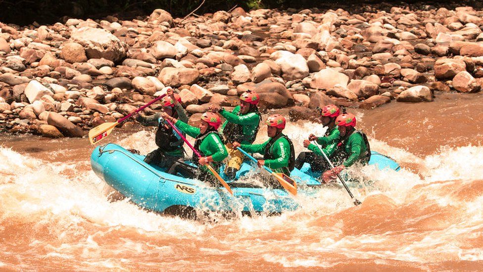 A photo of the team at Caguán Expeditions whitewater rafting
