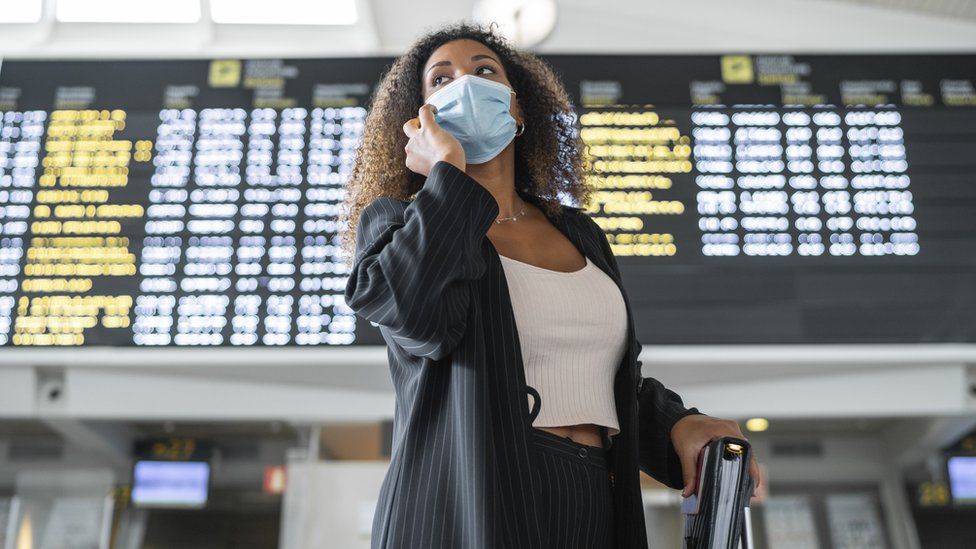 Woman wearing face mask at an airport