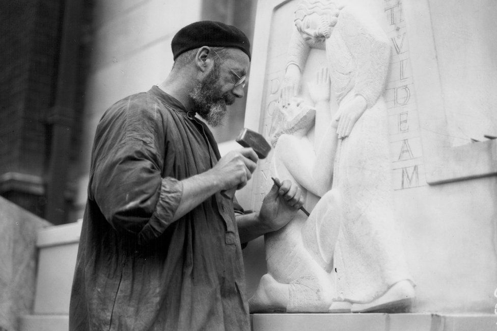 Eric Gill working on a sculpture at Moorfields Eye Hospital in 1934