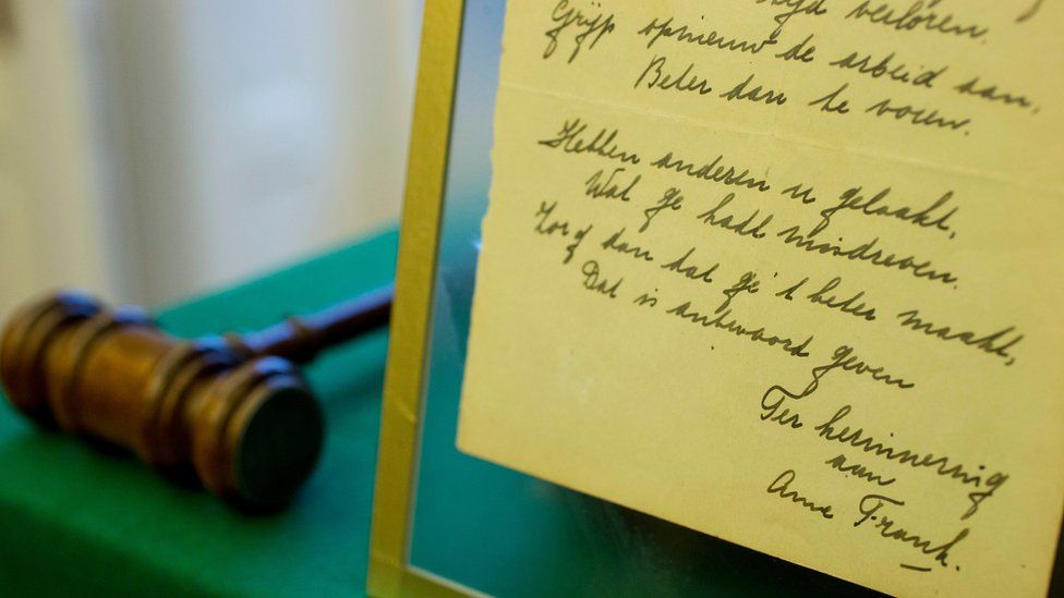 Anne Frank's 1942 handwritten poem and an auctioneer's hammer