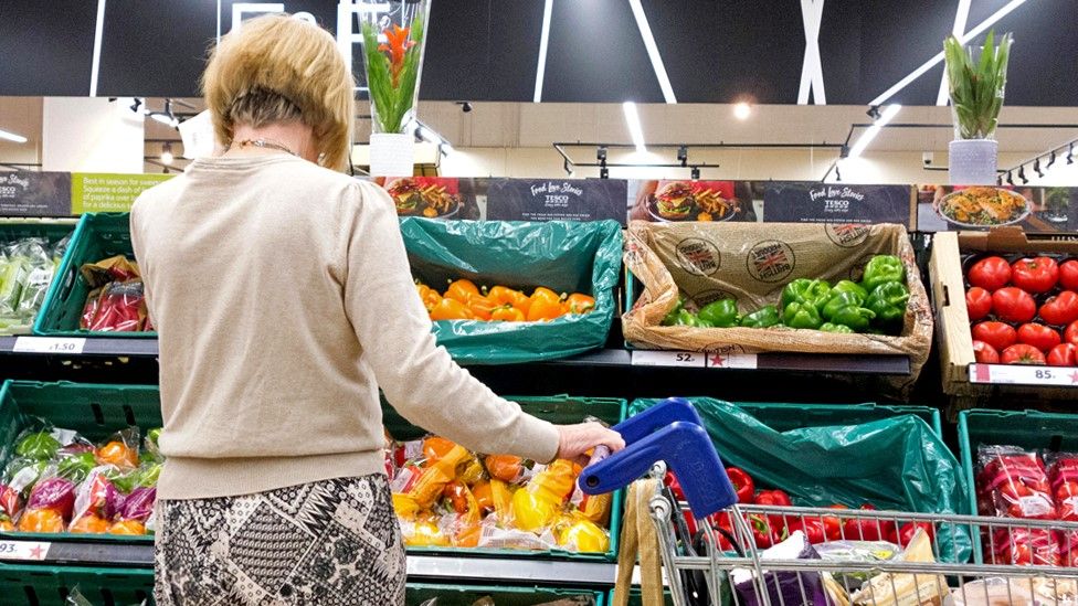 Woman browsing fruit and vegetables