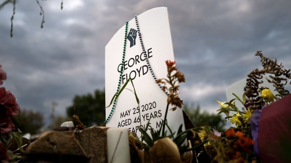 A headstone for George Floyd stands at the "Say Their Names" cemetery at George Floyd Square