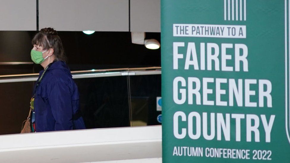 Delegates walk around the Green Party annual conference