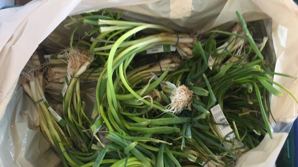A box of spring onions