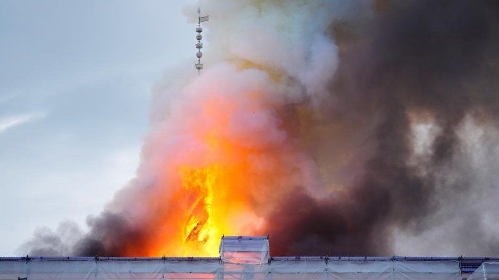 Smoke billows during a fire at the Old Stock Exchange, Boersen, in Copenhagen, Denmark April 16, 2024