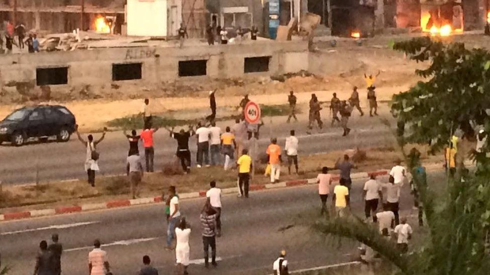 Soldiers patrol near the opposition headquarters