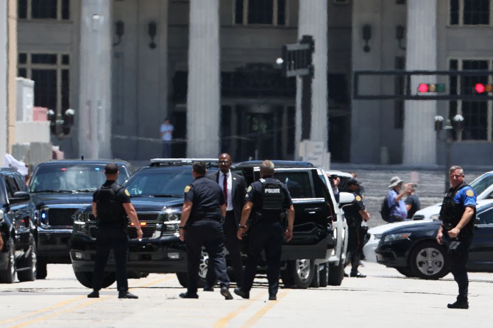 Law enforcement officers operate as the motorcade former U.S. President Donald Trump arrives at the Wilkie D. Ferguson Jr. United States Courthouse, to appear at his arraignment on classified document charges, in Miami, Florida