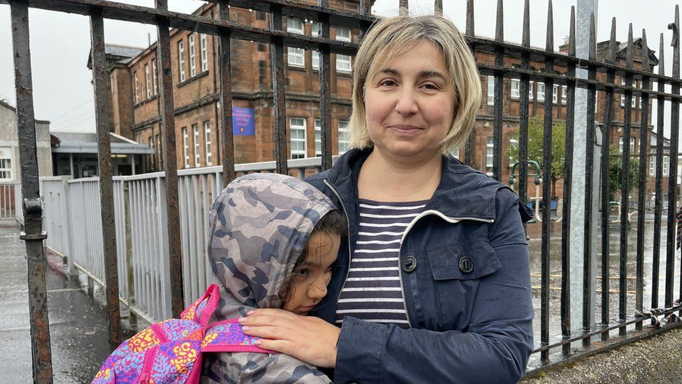 Zornista Koleva and her daughter outside a school in Paisley