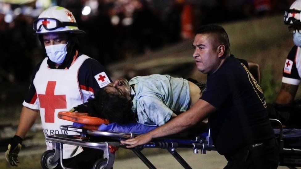 Rescuer workers carry an injured person on a stretcher in Mexico City, Mexico. Photo: 4 May 2021