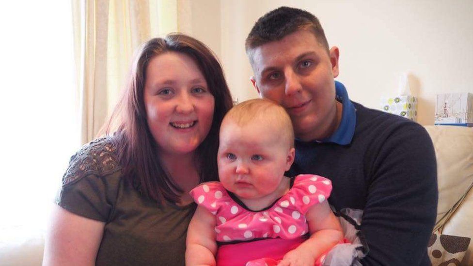 Brendan Broadmead with his partner and young daughter