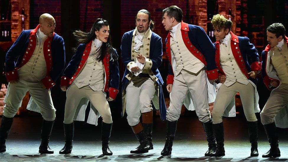 Lin-Manuel Miranda (centre) performing with other Hamilton cast members