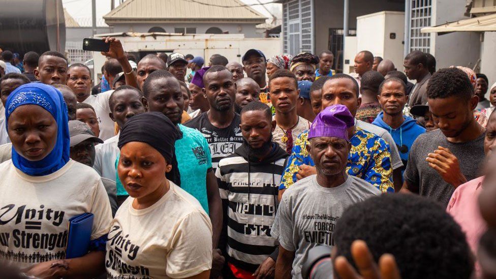 Tarkwa Bay residents stand outside a Federal High Court in Lagos on February 13, 2020