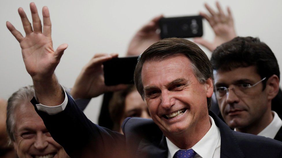Presidential candidate Jair Bolsonaro waves to crowds during a ceremony in Brasilia, Brazil on 7 March 2018