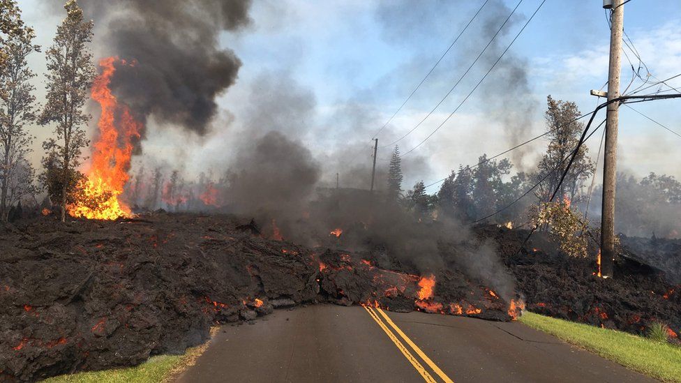 This image released by the US Geological Survey shows lava from a fissure slowly advancing to the northeast on Hookapu Street in Leilani Estates, Hawaii, on May 5, 2018.