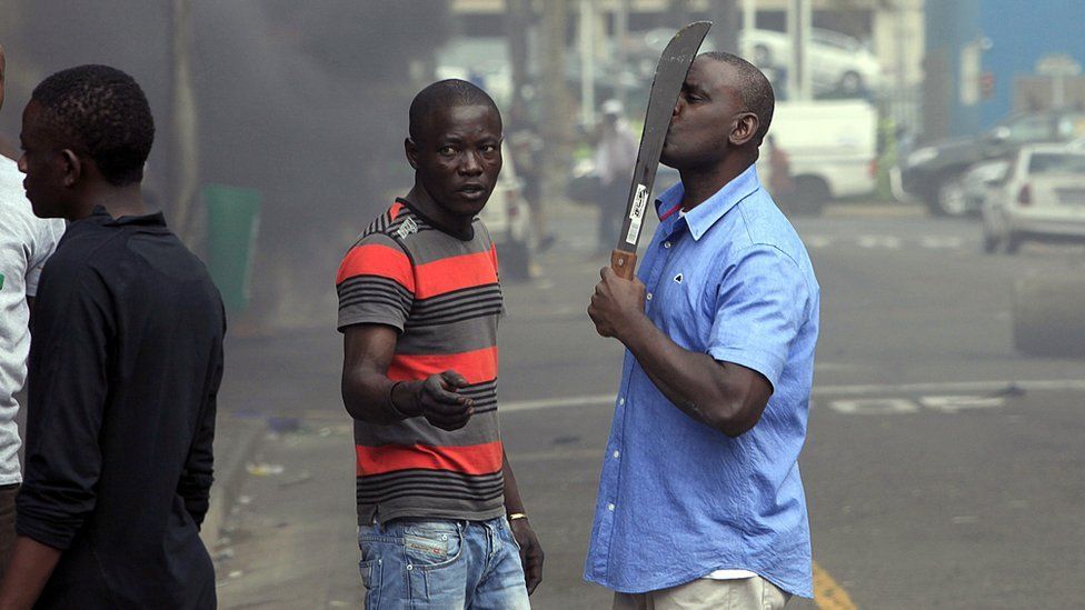 An armed man in South Africa during anti-foreigner violence