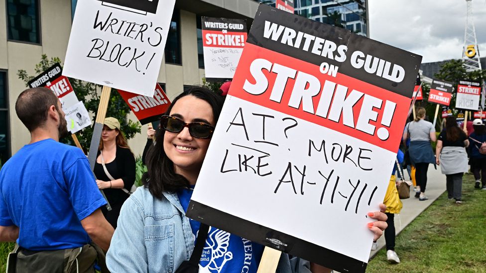Writer Ilana Pena holds her sign on the picket line on the fourth day of the strike by the Writers Guild of America in front of Netflix in Hollywood, California, on May 5, 2023