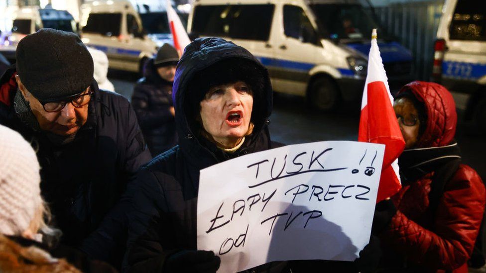 Former government supporters protest in front of the public tv channel TVP headquarters in Warsaw, Poland on 21 December 2023.