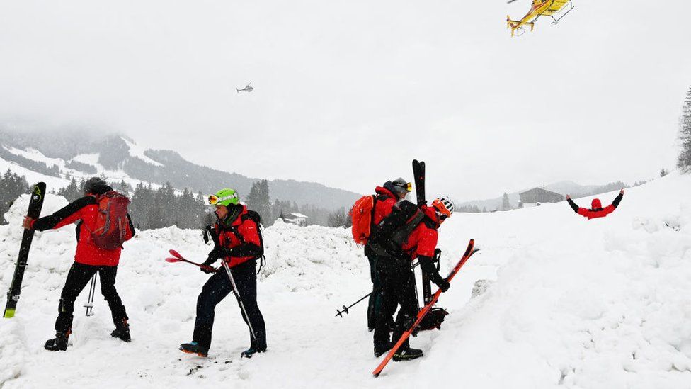 A photo taken on February 4, 2023 shows rescuers during their mission near Fieberbrunn, western Austria.