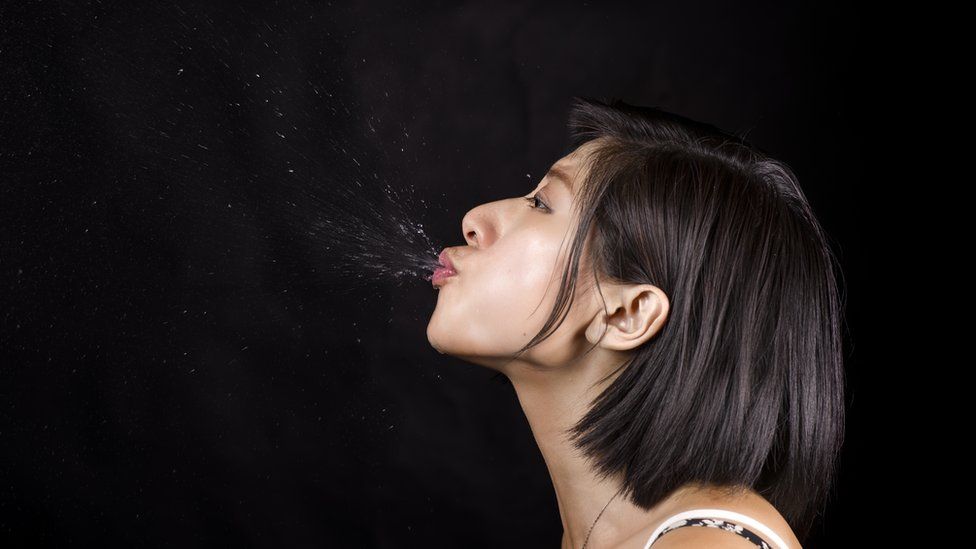 Woman spitting