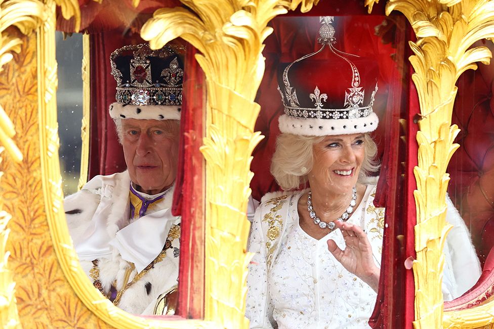 King Charles and Queen Camilla travel from Westminster Abbey in the Gold State Coach