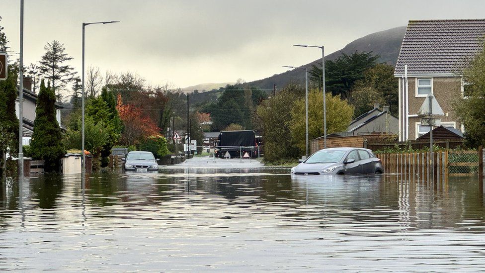 Cars submerged in flood water in Camlough