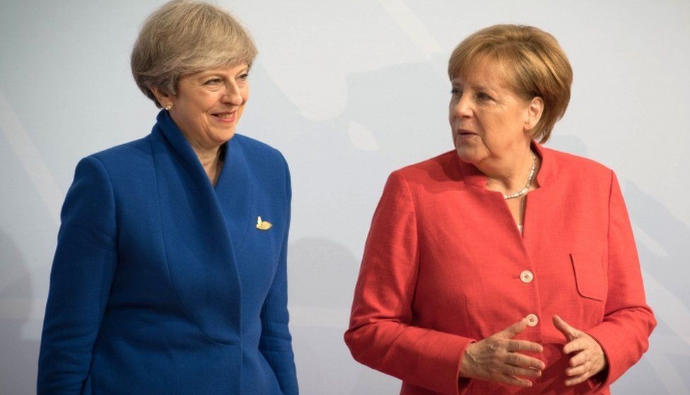 Prime Minister Theresa May and German Chancellor Angela Merkel attend the G20 summit on 7 July, 2017 in Hamburg, Germany