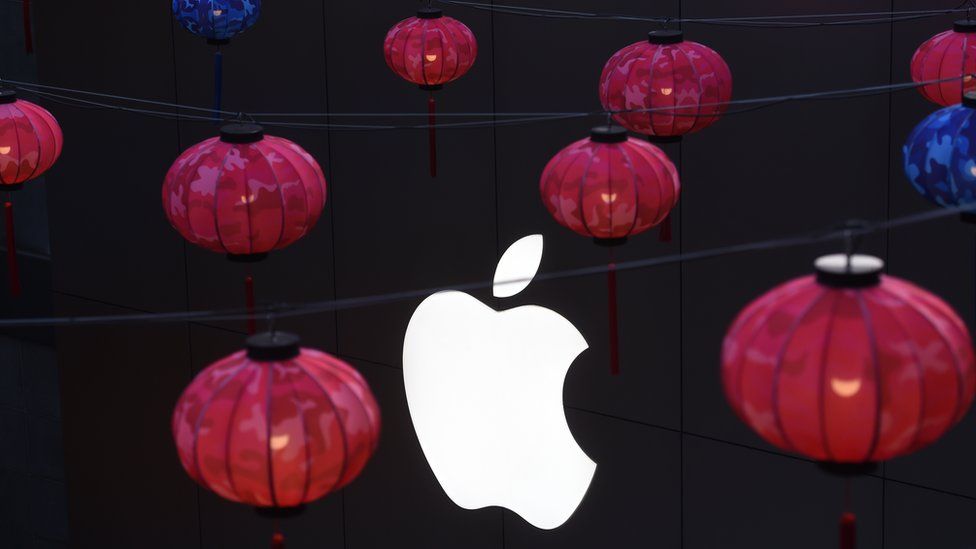 Lanterns hanging in front of Apple logo