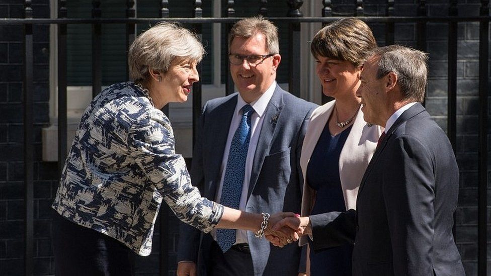 Theresa May greets Arlene Foster and other DUP figures in Downing Street