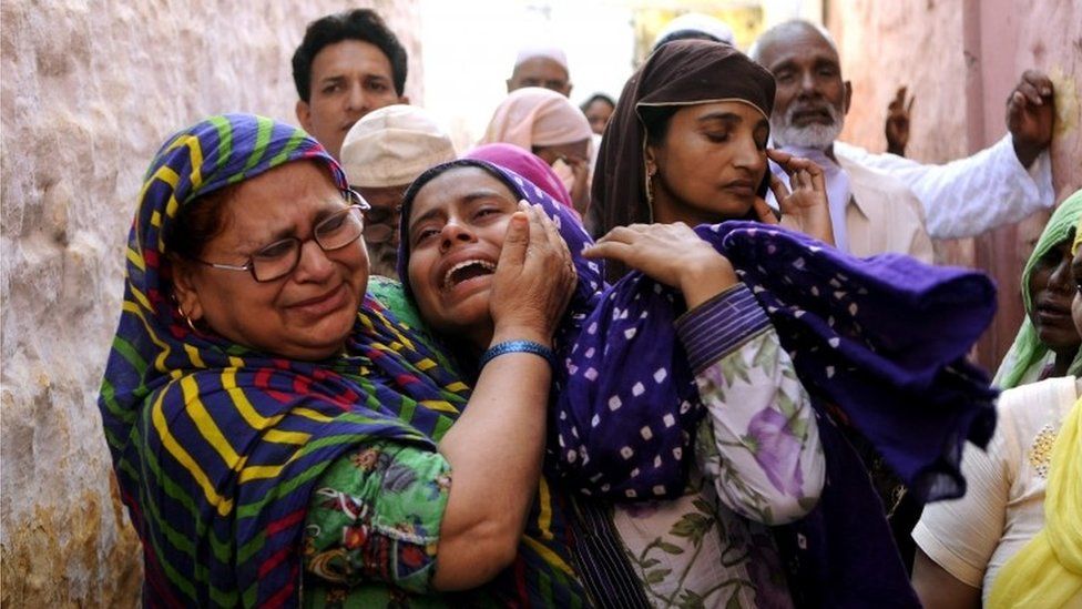 Relatives mourn slain Indian villager Mohammad Akhlaq in the village of Bisada, some 35 kilometres (22 miles) north-east of New Delhi,