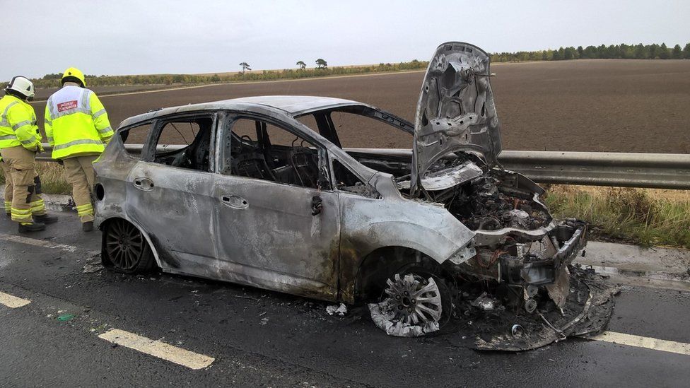 Burnt car on A34