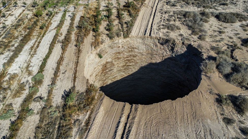 Aerial view showing a large sinkhole near the mining town of Tierra Amarilla, Copiapo Province, in the Atacama Desert in Chile.