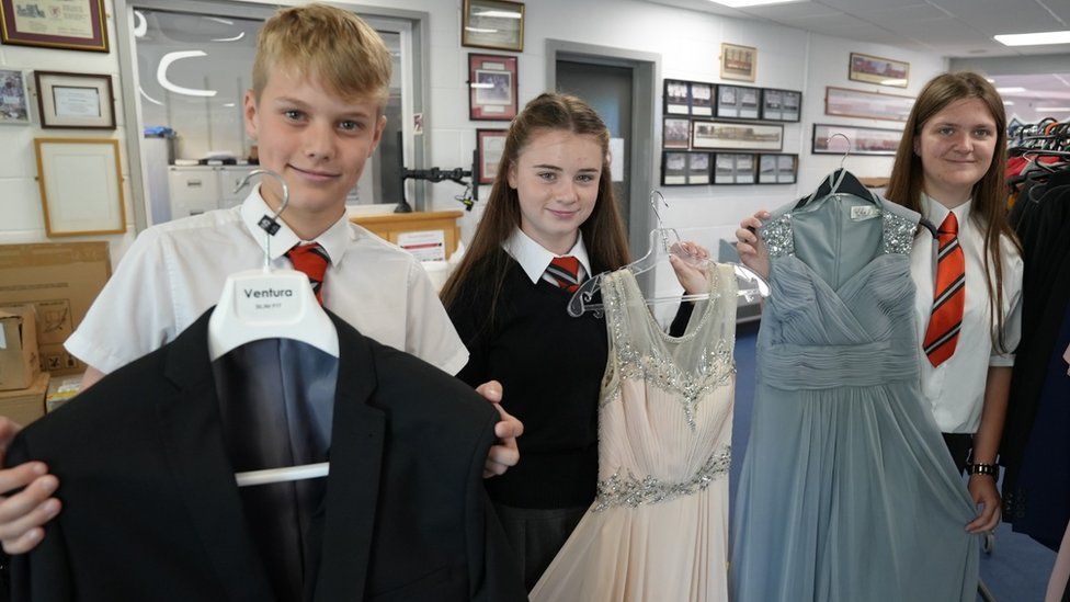 Pupils from Ysgol Cwm Rhymni show off a selection of outfits on a clothes rail