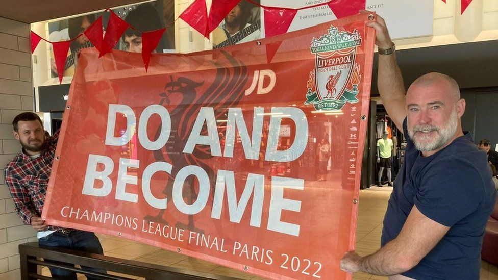 Liverpool fans with banners at LJA