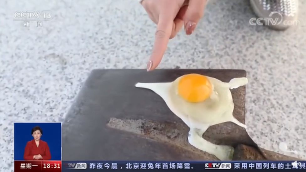 An egg is broken on a cold surface in Mohe